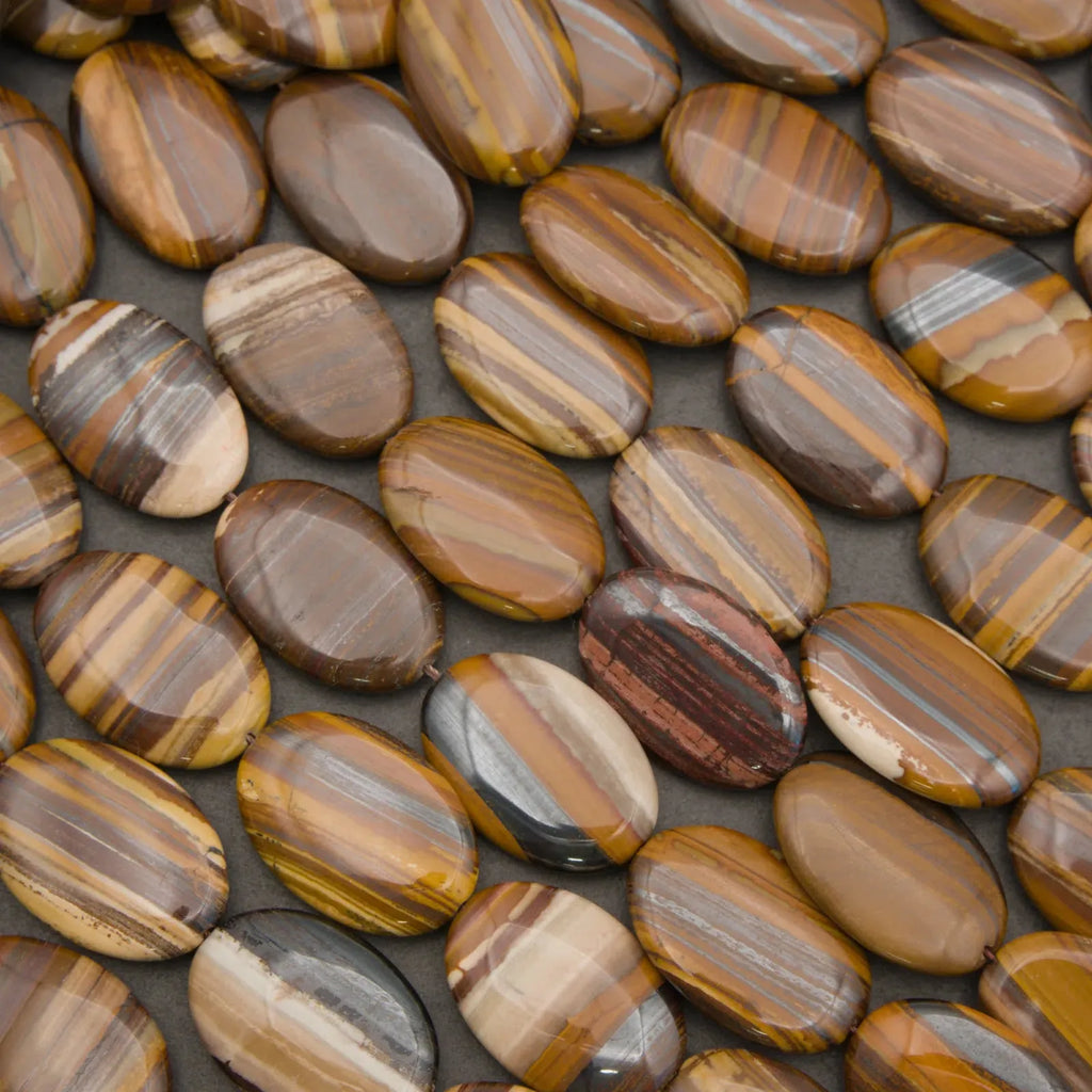 Natural Tiger Iron oval beads with distinctive striped patterns formed from Tiger Eye, Hematite, and Jasper.