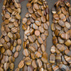 High-quality Tiger Iron oval beads showcasing rich brown, gray, cream, and reddish bands in a polished finish.