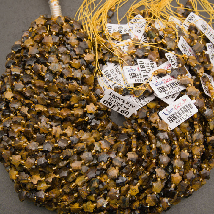 A bundle of faceted tiger's eye star bead strands with Tejas Beads tags