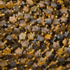 Close-up of faceted tiger's eye star beads showing shifting golden chatoyant stripes