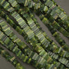 Close-up of green beaded strands on a neutral background