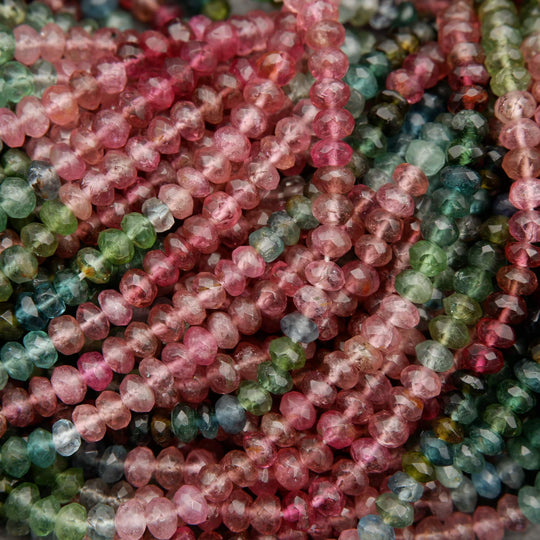 Close-up of multicolored bead strands intertwined