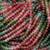 Close-up of multicolored bead strands intertwined