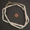 Ivory colored elongate tube shape beads.