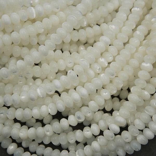 Close-up of white pearls on a dark background