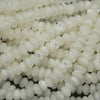 Close-up of white round beads