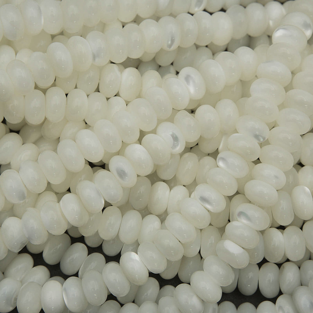 Close-up of white round beads