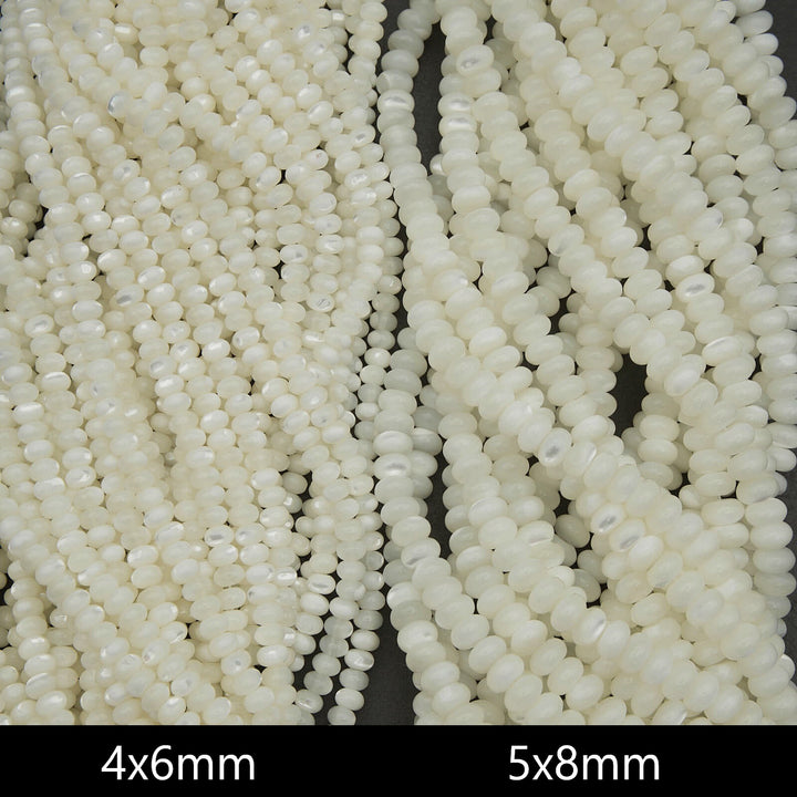 Close-up of two strands of white beads with size labels '4x6mm' and '5x8mm'.