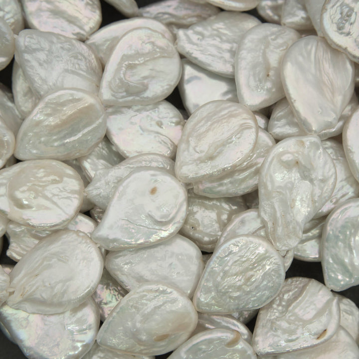 Close-up of white teardrop-shaped pearls.