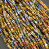 Close-up of colorful beaded necklaces on a gray background