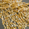 Close-up of small yellow and white stones on a gray background