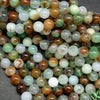 Green, brown, and white australian chrysoprase round beads. Loose beads for DIY and handmade jewelry making.