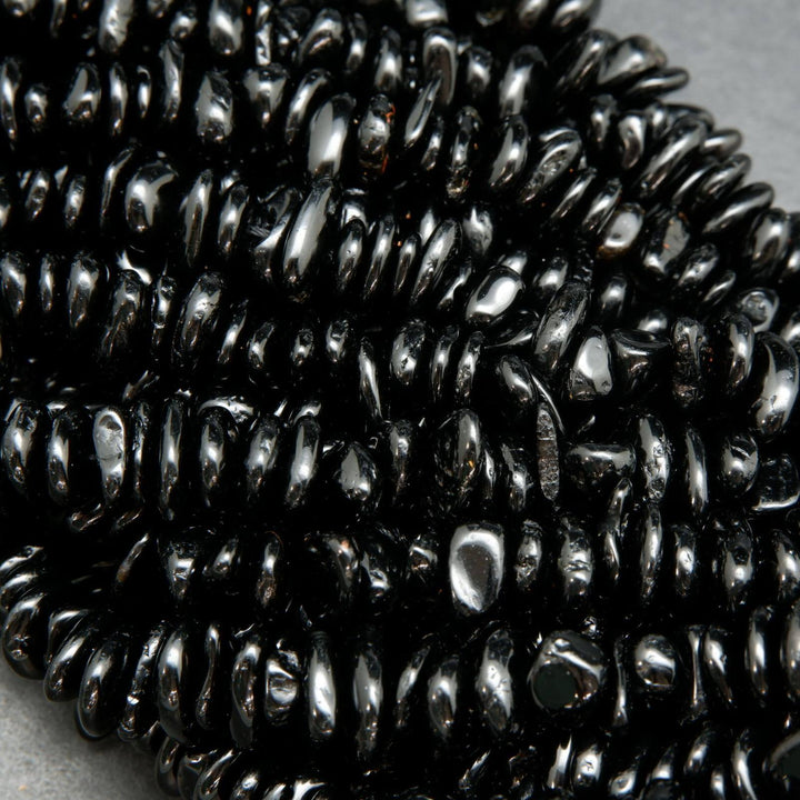 Polished black tourmaline chip beads.