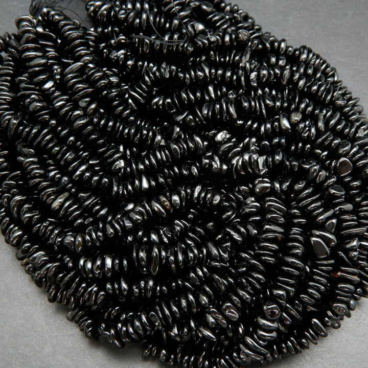 Polished black tourmaline chip beads.