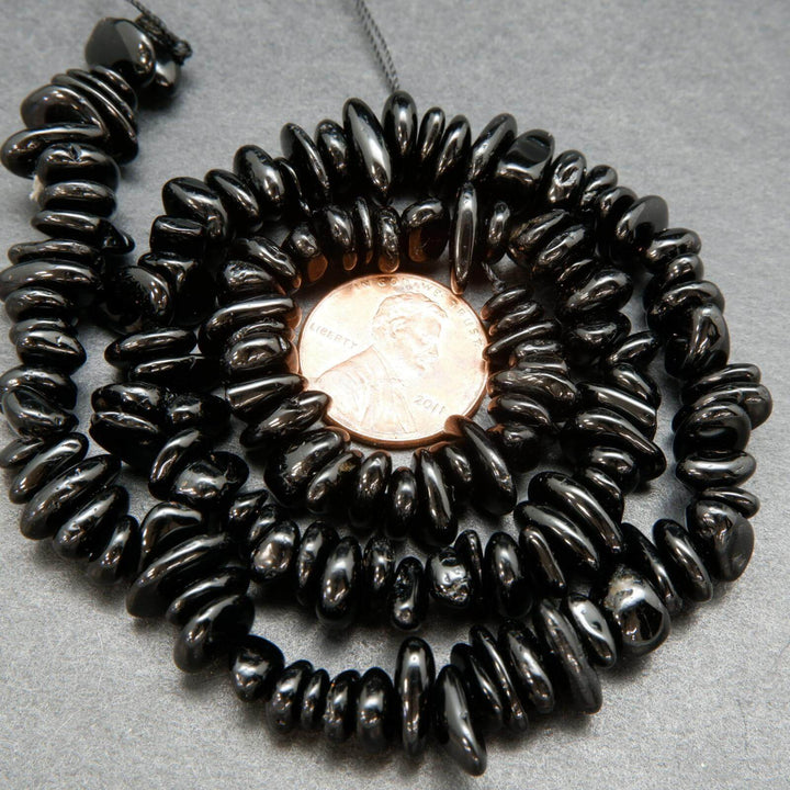 Polished black tourmaline chip beads.