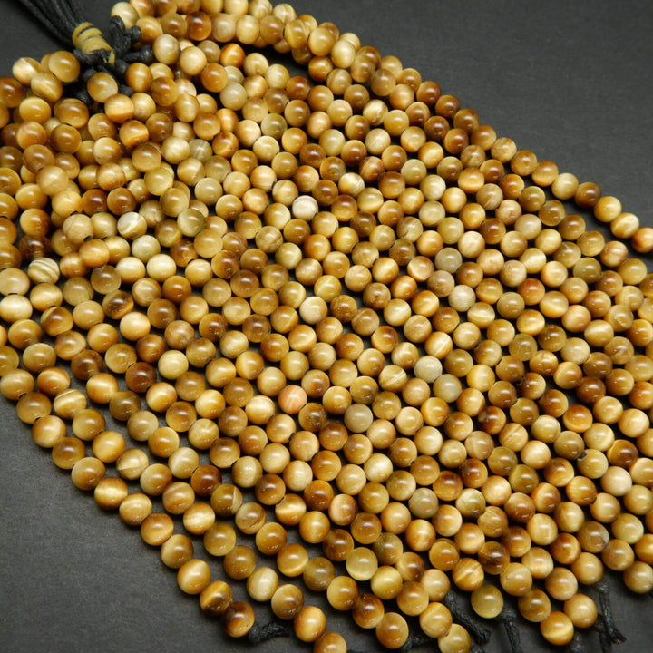 Large hole yellow blonde tiger's eye beads.