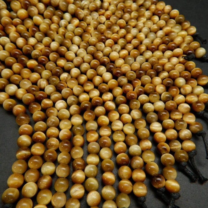 Large hole yellow blonde tiger's eye beads.