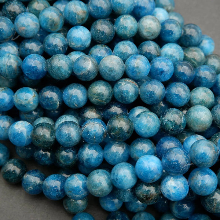 Round polished blue apatite beads.
