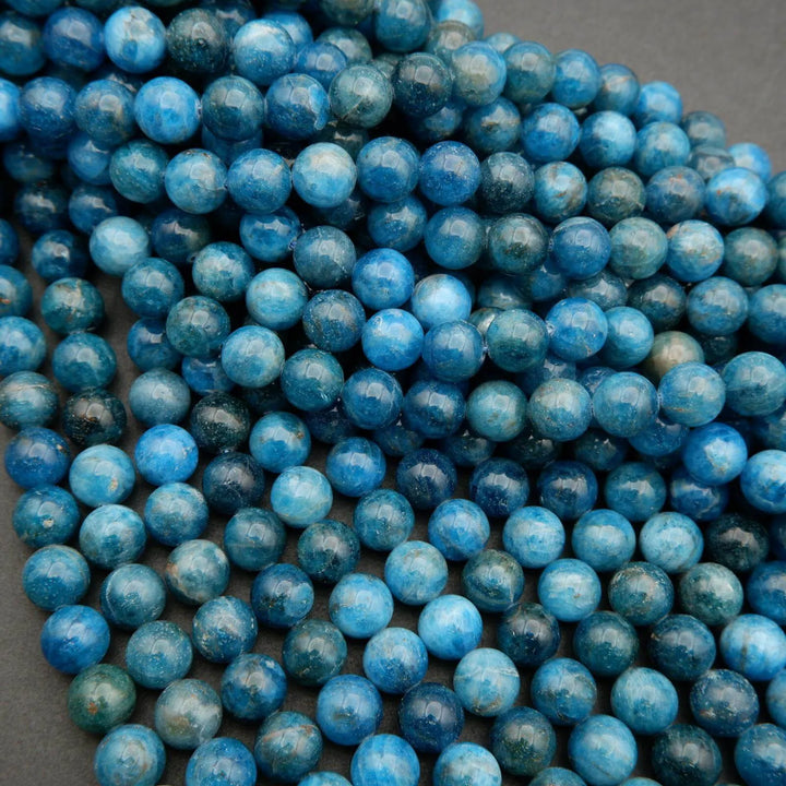 Round polished blue apatite beads.