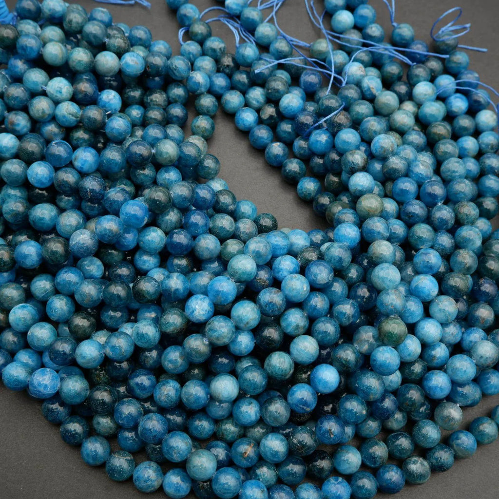 Round polished blue apatite beads.