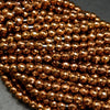 Faceted bronze hematite beads.