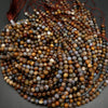 Brown dendritic opal beads.