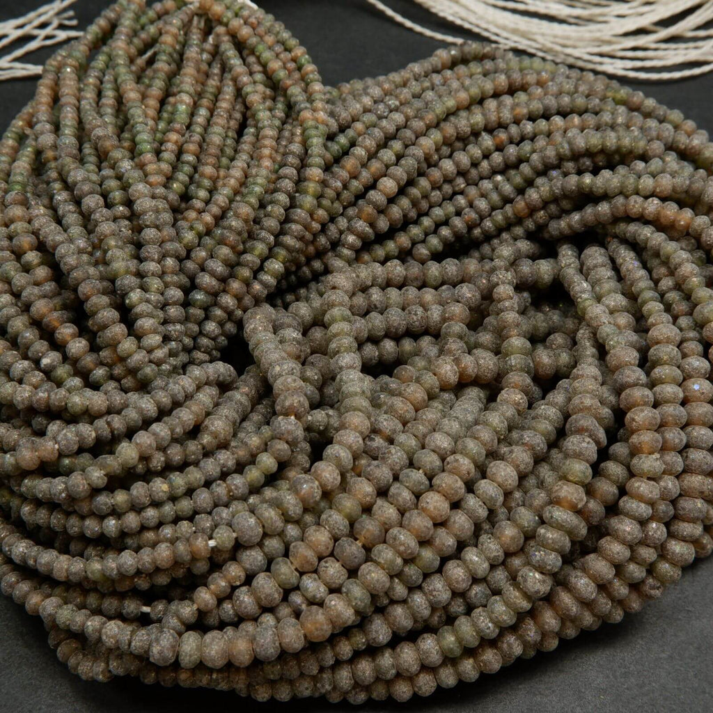 Matte and rough brown roman glass rondelle beads.