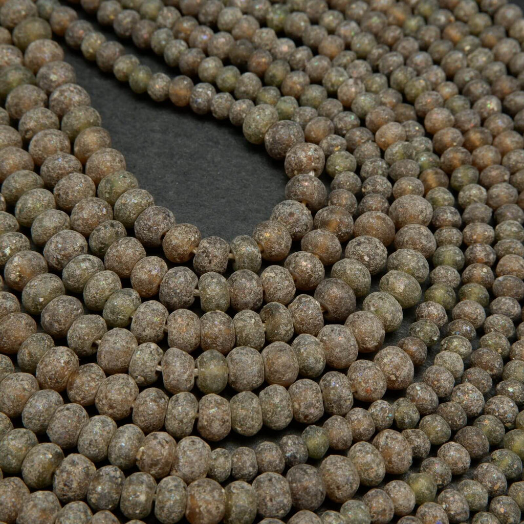 Matte and rough brown roman glass rondelle beads.