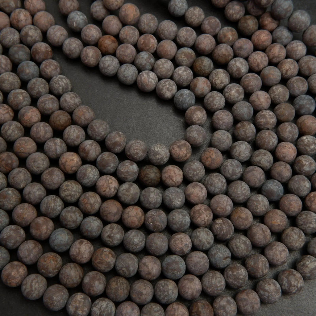 Matte finish brown snowflake obsidian beads.