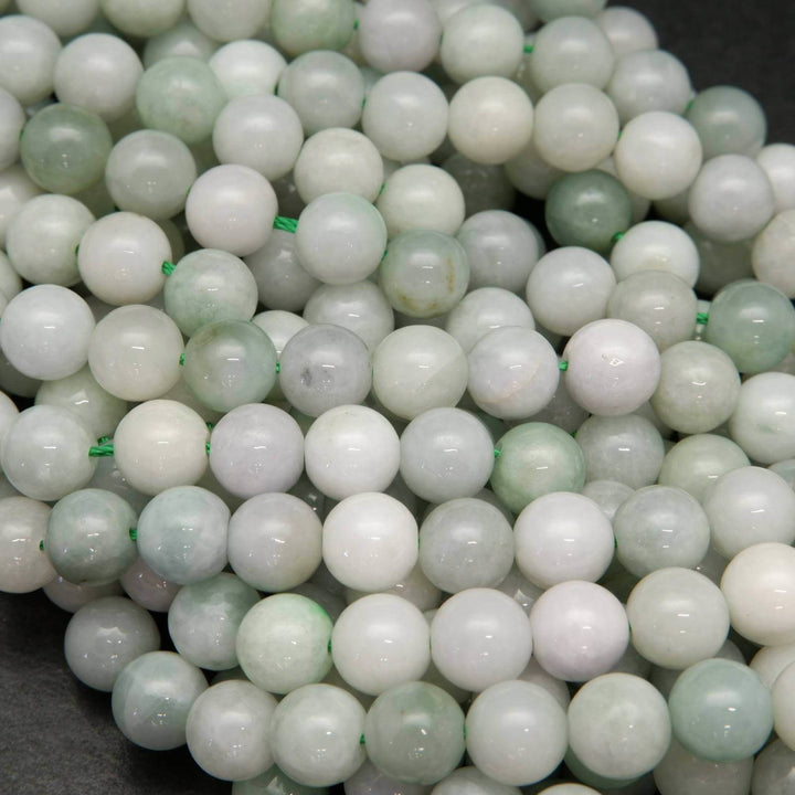 Green and white Burmese jade beads.