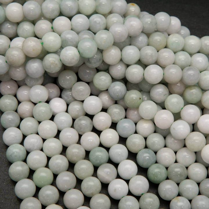 Green and white Burmese jade beads.