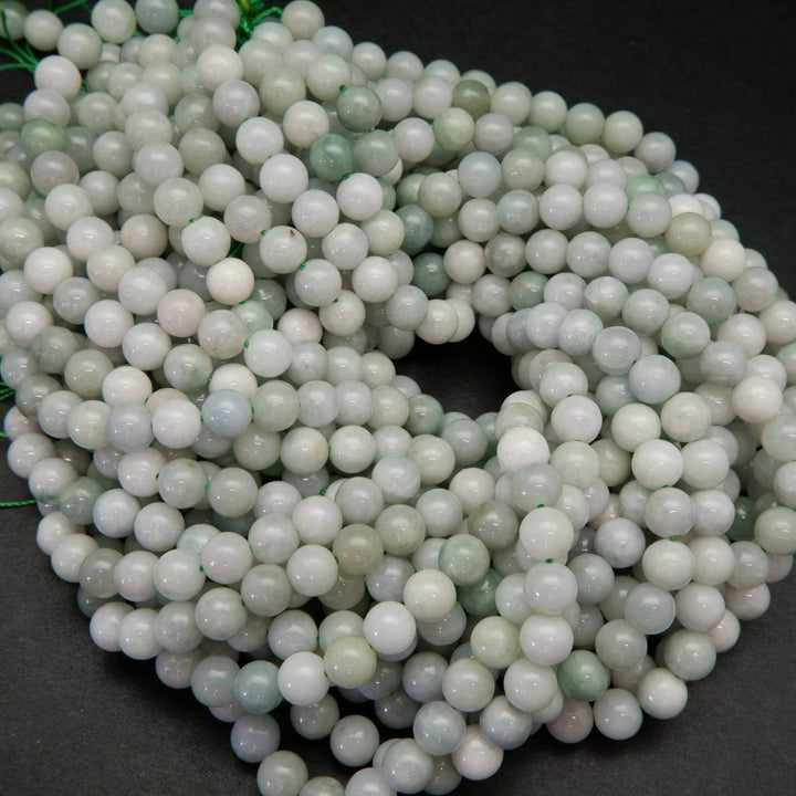 Green and white Burmese jade beads.