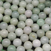 Green and white Burmese jade beads.