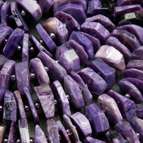 Purple charoite disk shape beads.