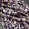 Chevron Amethyst barrel shape beads.