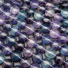 Multicolor fluorite coin shape beads.