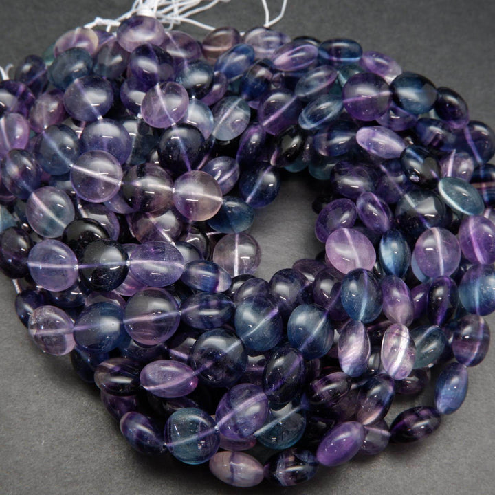 Multicolor fluorite coin shape beads.