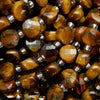 Faceted coin shape tiger eye beads.
