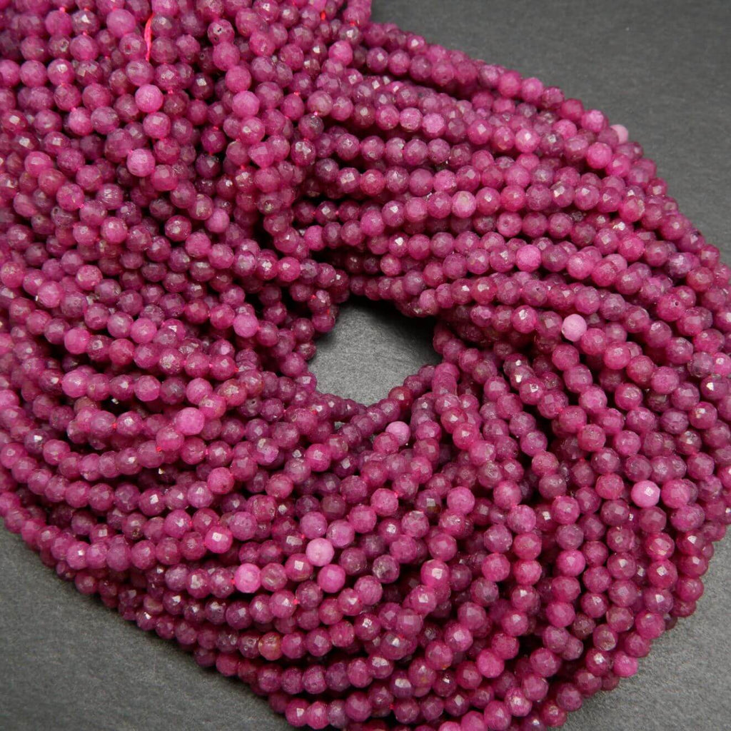Natural ruby beads. Faceted round loose beads.