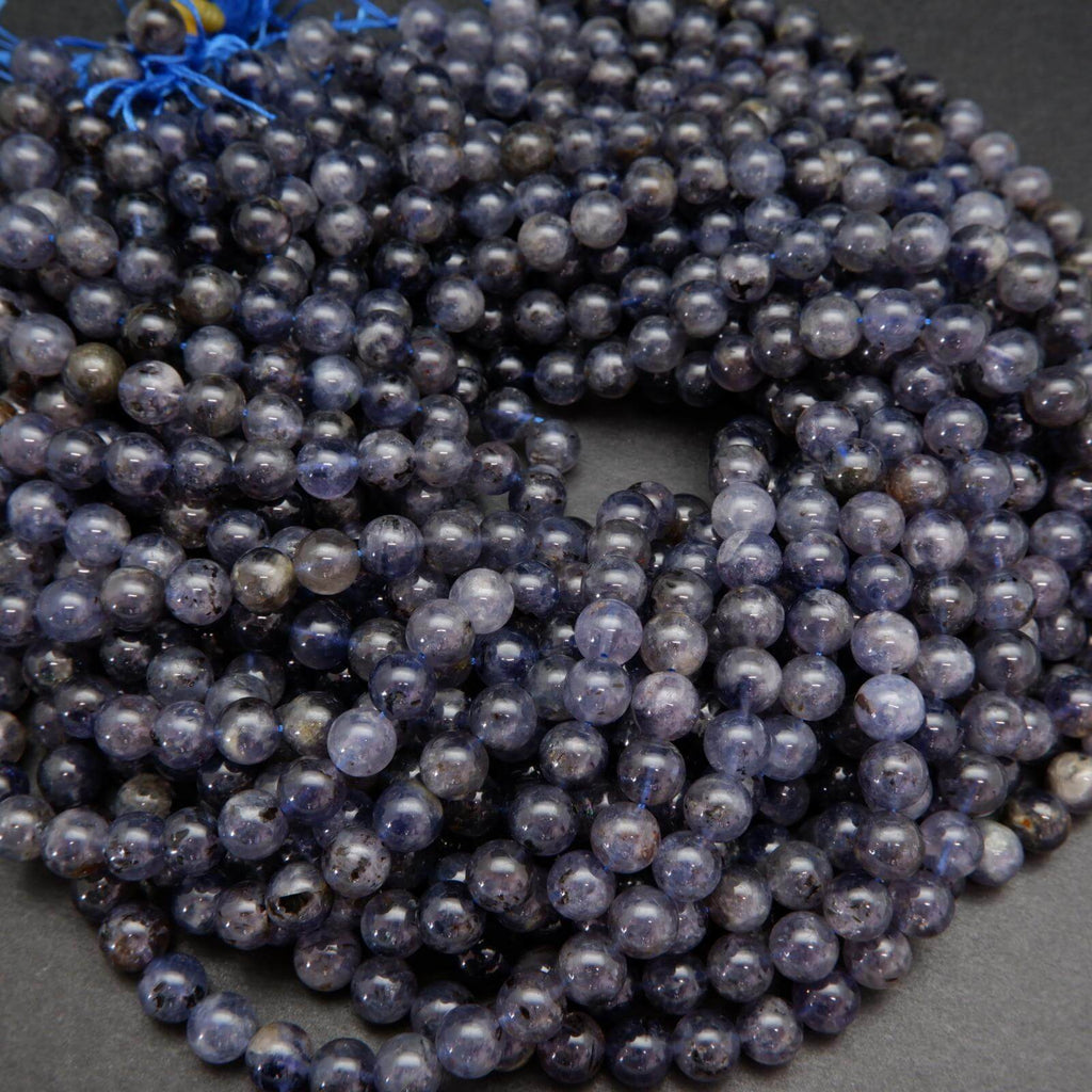Polished purple and blue iolite beads.