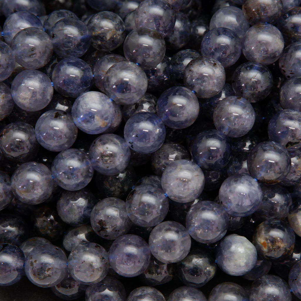 Polished purple and blue iolite beads.
