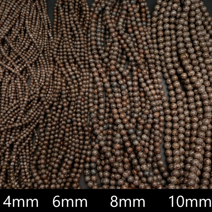 Brown snowflake obsidian beads.