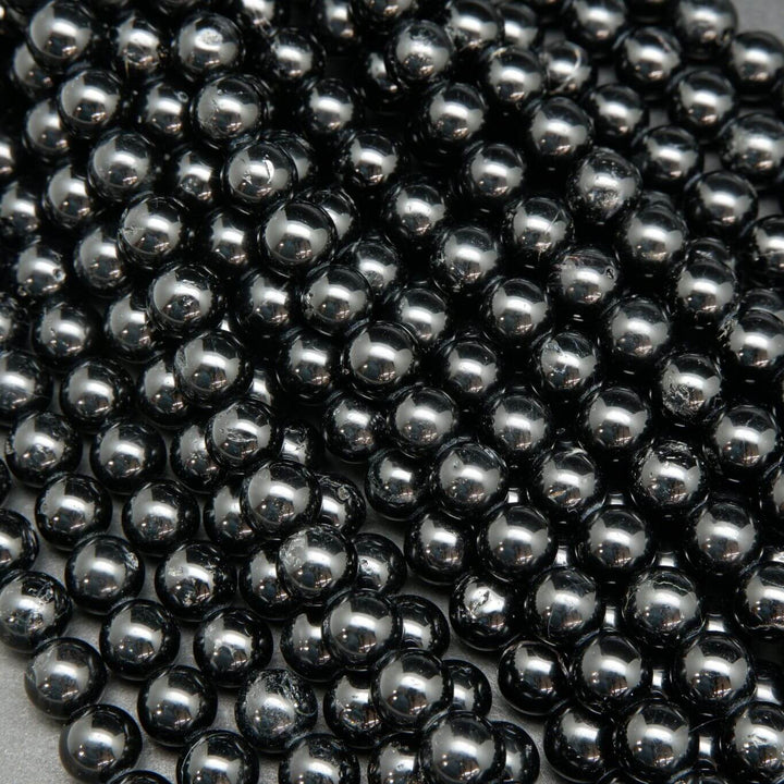 Polished Black Tourmaline Beads.