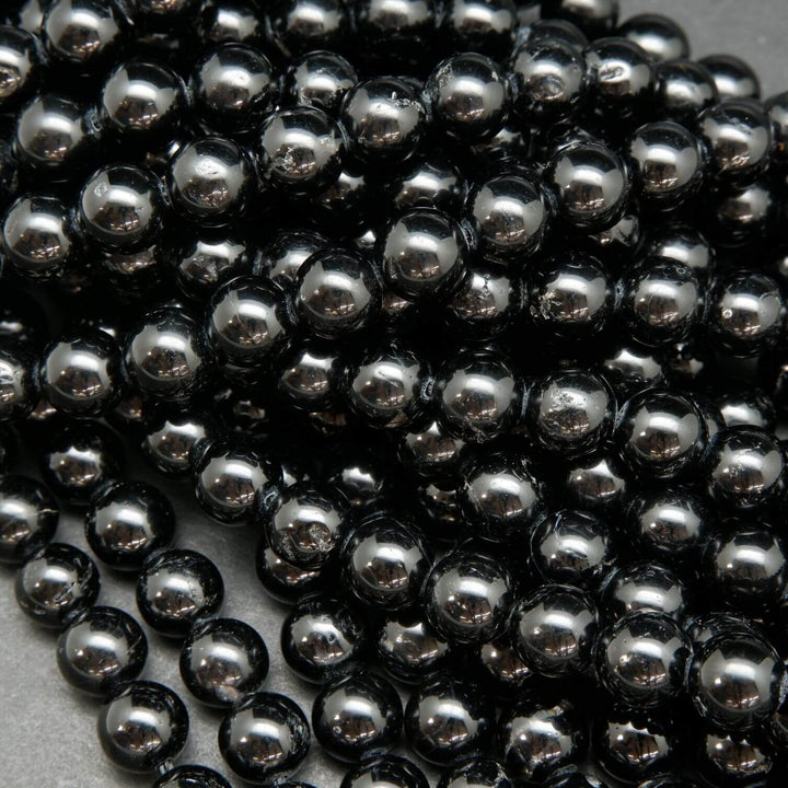Polished Black Tourmaline Beads.