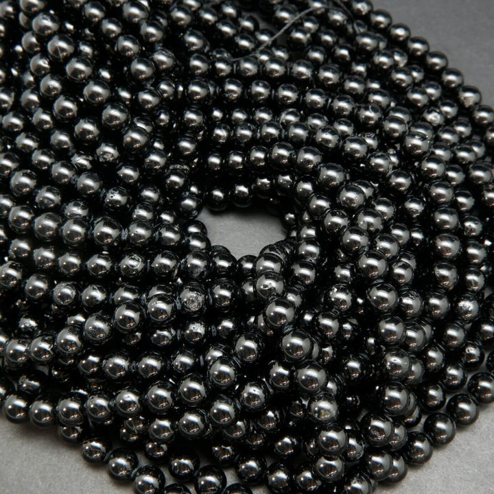 Polished Black Tourmaline Beads.