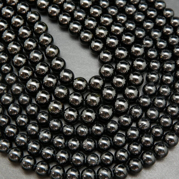 Polished Black Tourmaline Beads.