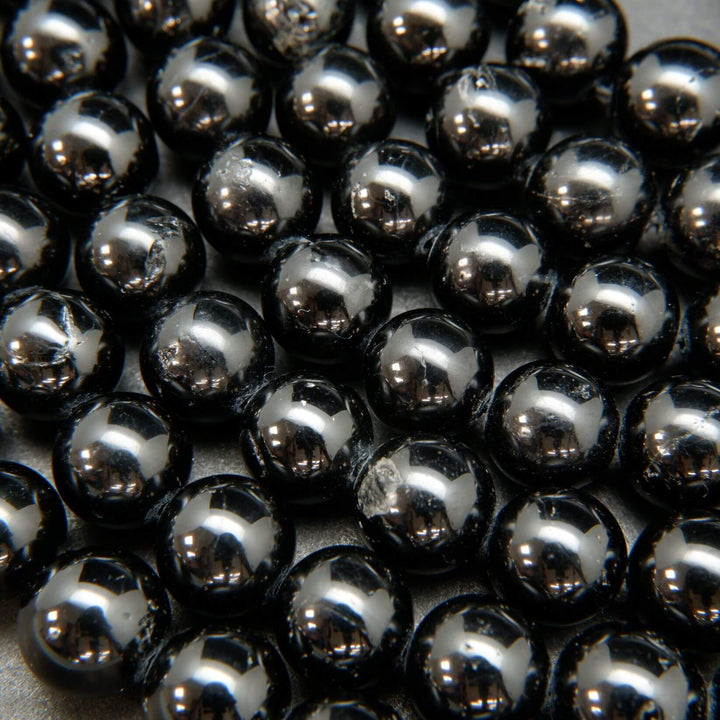 Polished Black Tourmaline Beads.