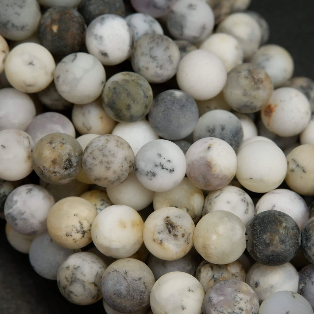 White dendritic opal beads.