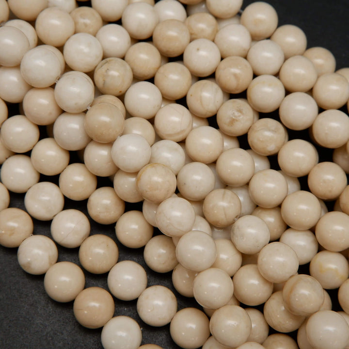 Beige color fossil jasper beads.