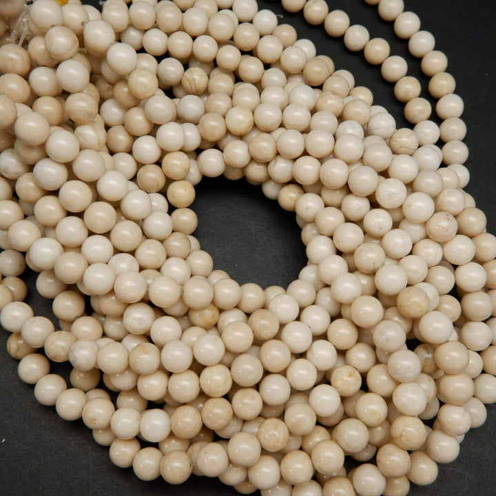 Beige color fossil jasper beads.